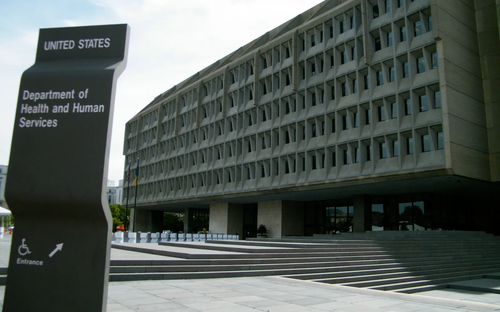 The Hubert H. Humphrey Building in Washington, D.C., headquarters of the Department of Health and Human Services, with the department's entrance sign in the foreground
